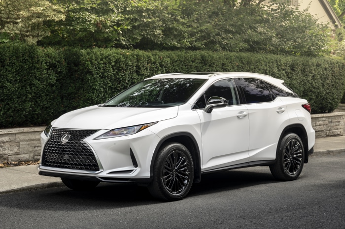 White Lexus RX 350 4K SUV parked on a street
