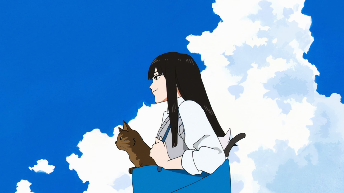 Girl with cat in bag under blue sky