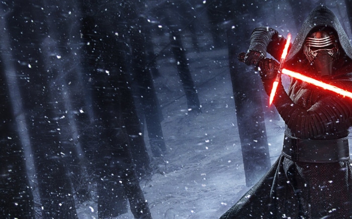 Kylo Ren from Star Wars holding a lightsaber in a snowy forest