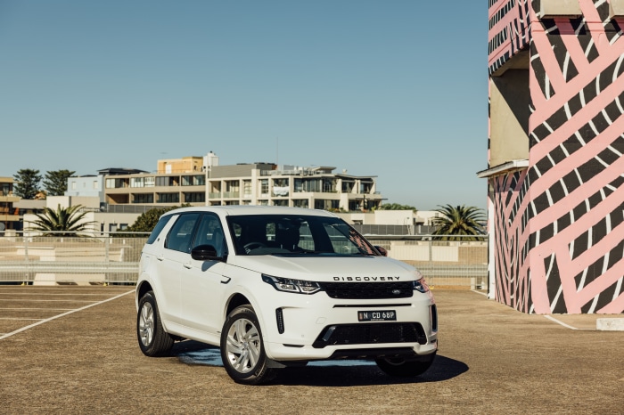 White Land Rover Discovery Sport SUV parked outdoors