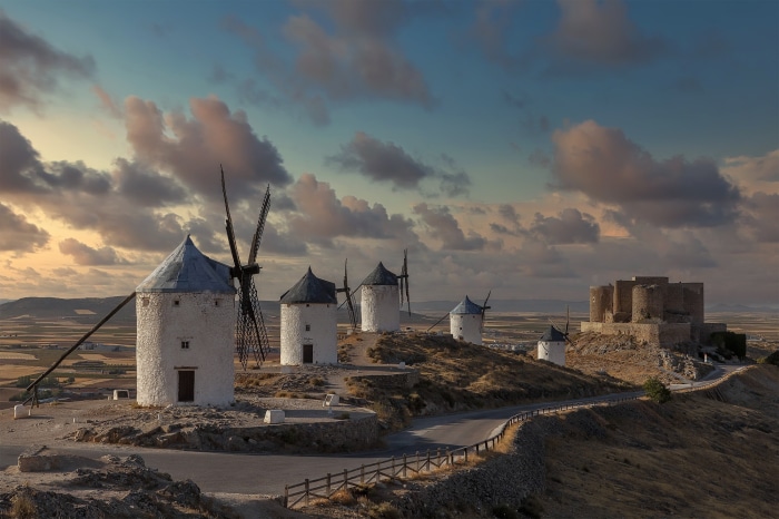 Windmills and castle on a hill in Spain