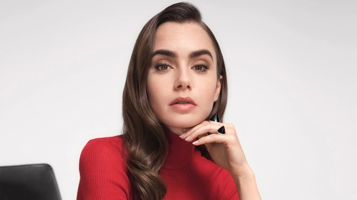 Lily Collins wearing a red turtleneck