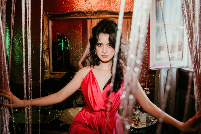 Laura Marano in a pink dress