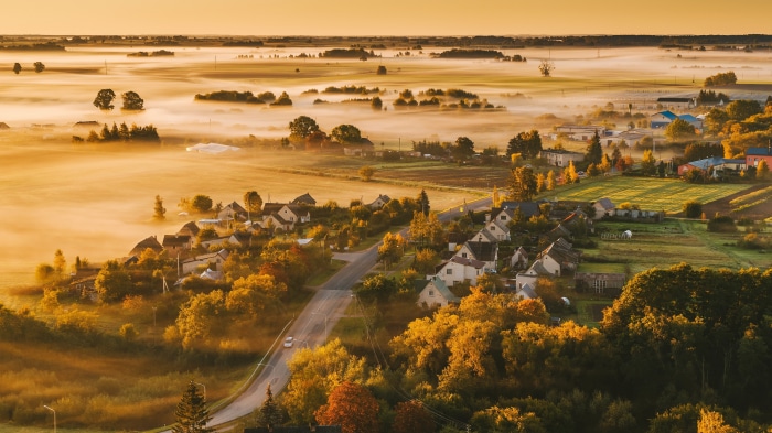 Foggy morning over a village in Lithuania