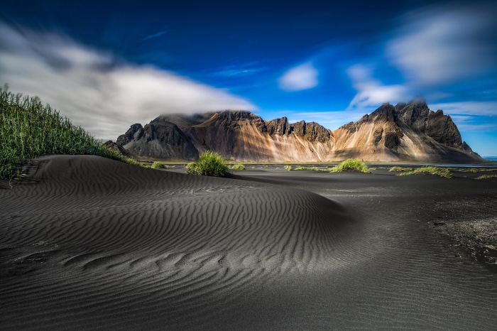 Black sand dunes and Vestrahorn mountains in Iceland
