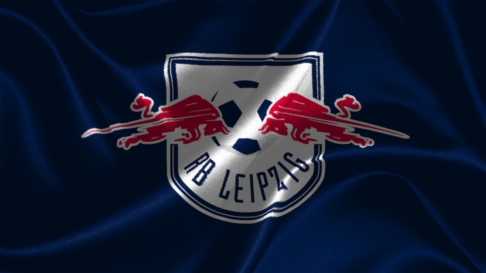 RB Leipzig logo on a dark blue wavy background
