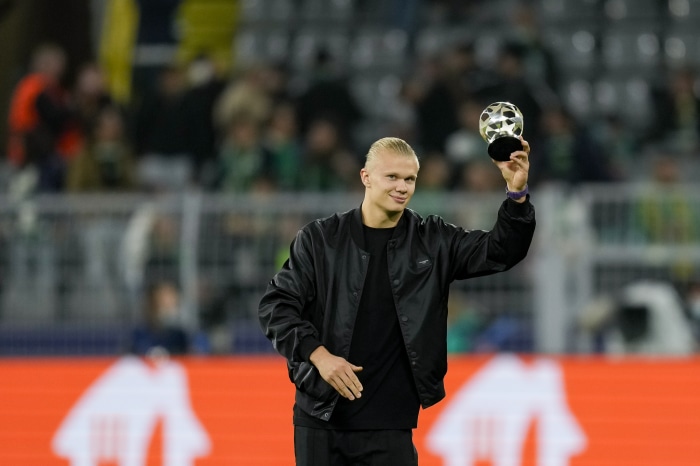 Erling Haaland holding a trophy