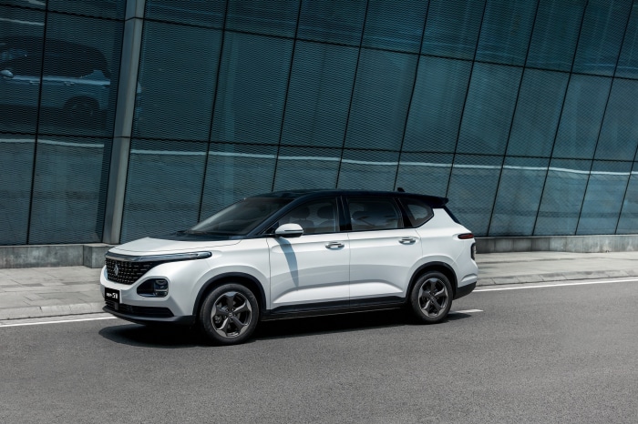 White Baojun RM-5 car parked on asphalt road