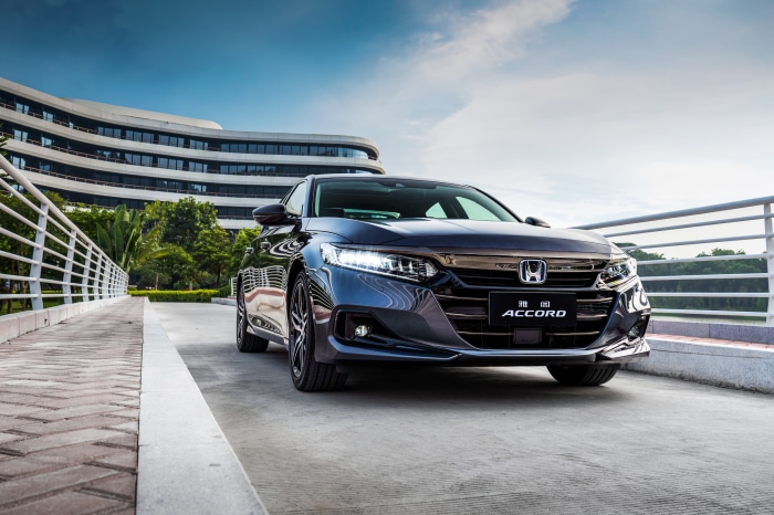 Honda Accord Sport Hybrid in front of a modern building