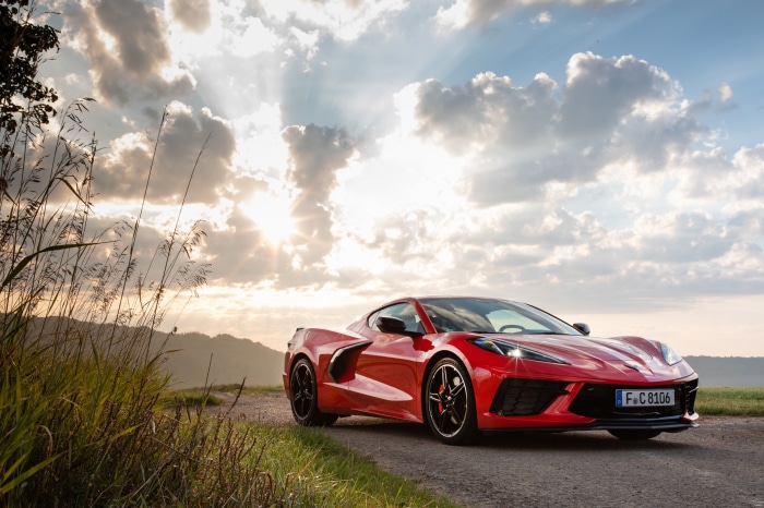 Red Chevrolet Corvette Stingray on a road