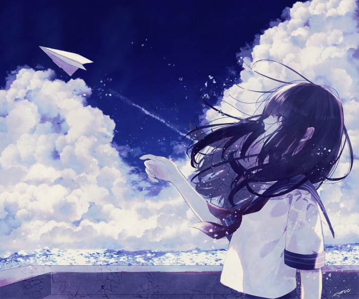 Girl in school uniform launching a paper airplane