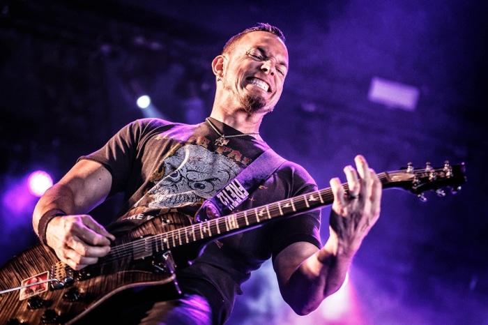 Mark Tremonti playing guitar on stage