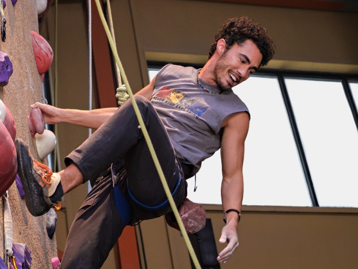 Darren Barnet climbing indoors