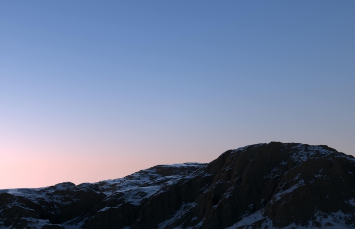 Sunset over a snow-dusted mountain