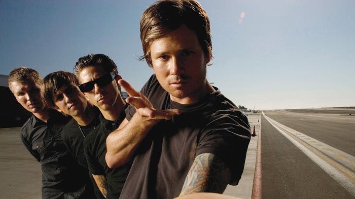Angels and Airwaves band members on tarmac