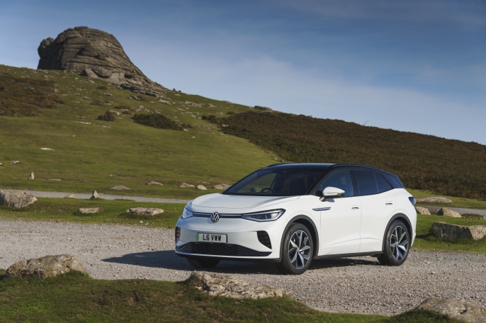 White Volkswagen ID.4 electric car parked on gravel road