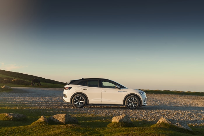 White Volkswagen ID.4 GTX electric car on gravel road