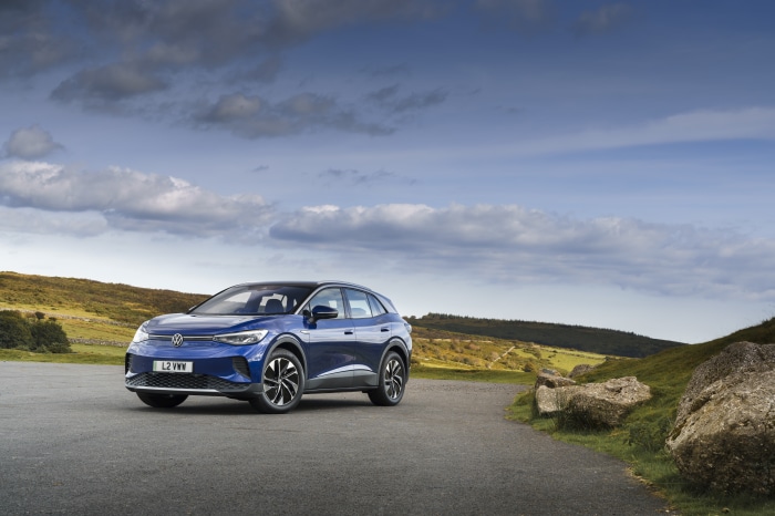 Blue Volkswagen ID.4 electric car on a road