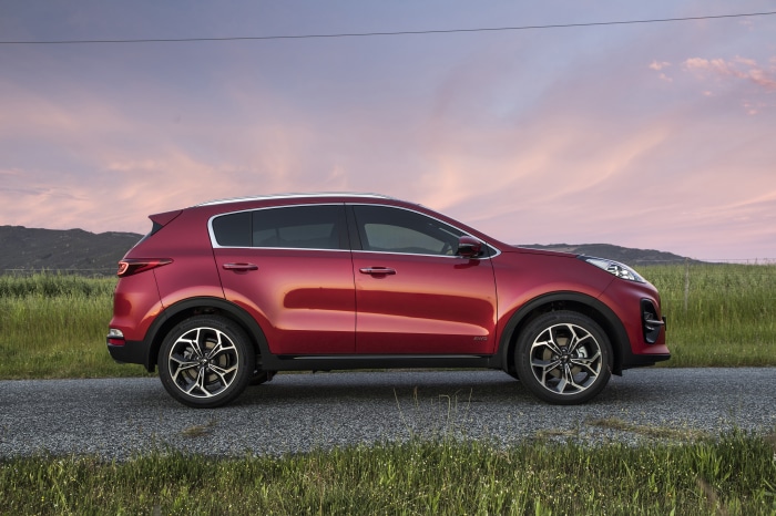 Red Kia Sportage SUV on a Road