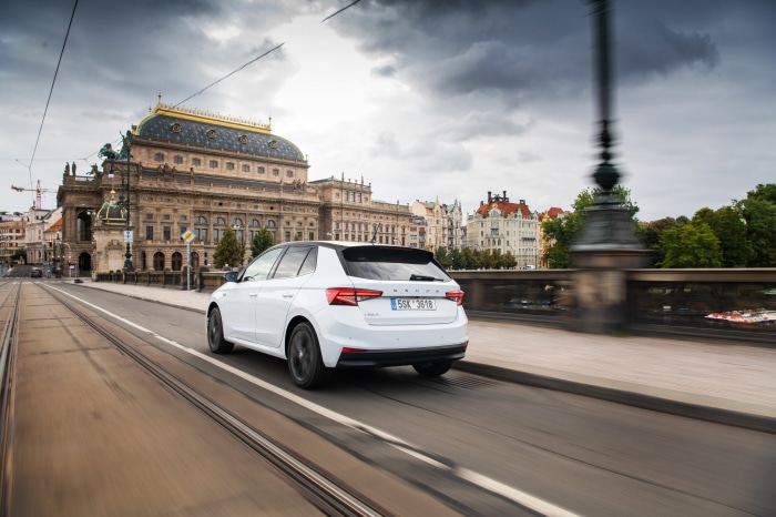 White Skoda Fabia driving on a bridge in Prague