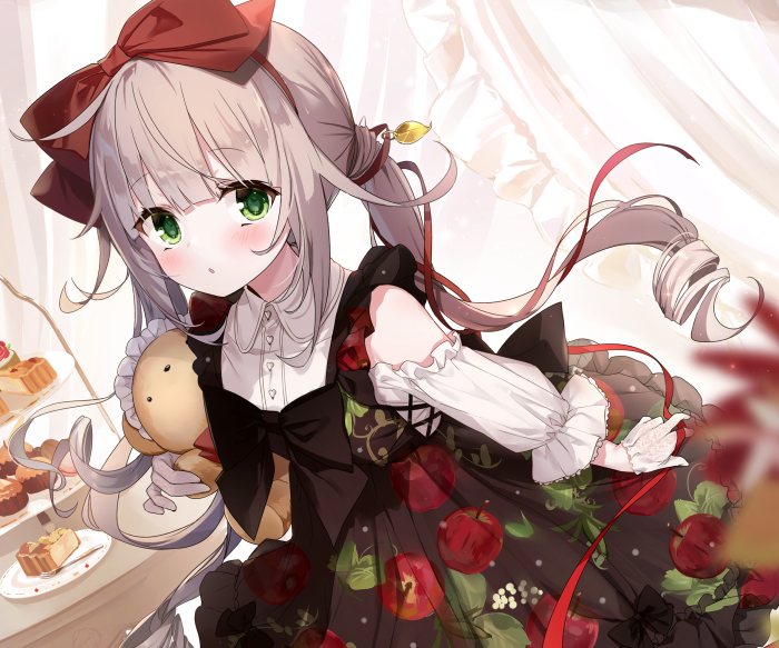 Girl with green eyes holding a teddy bear