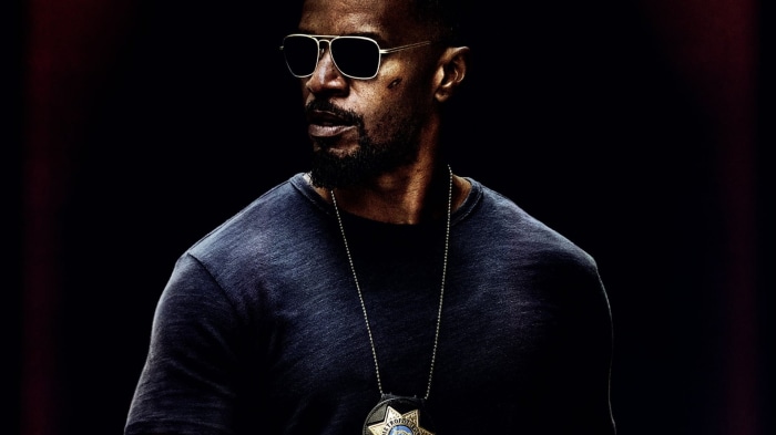 Jamie Foxx as a police officer