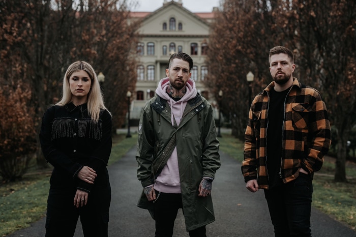 Spiritbox members in front of a building