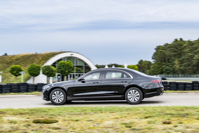 Black Mercedes-Benz S-Class driving on a track