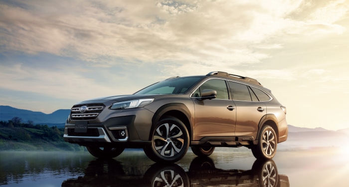 Subaru Outback SUV parked by a lake