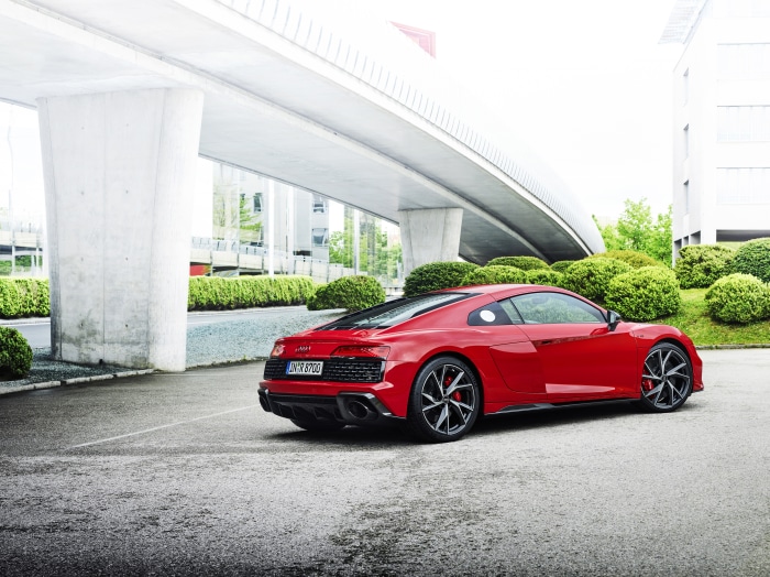 Red Audi R8 GT Spyder parked under a bridge