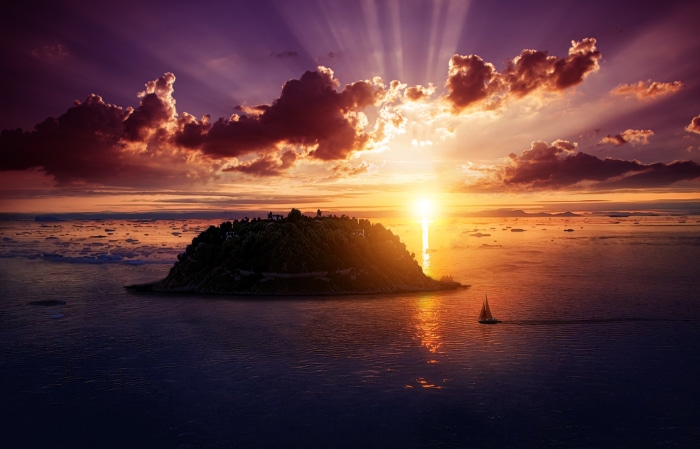Island with sailboat at sunset