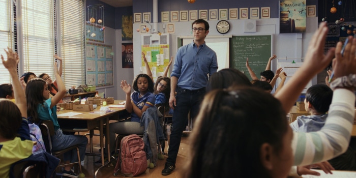 Mr. Corman with students in a classroom