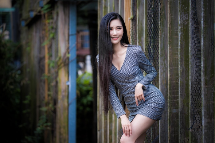 Asian Woman in Stylish Dress with Black Hair