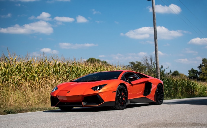 Orange Lamborghini Aventador on a Road