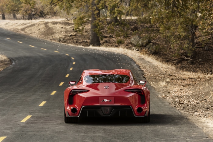Red Toyota FT-1 concept car on a winding road