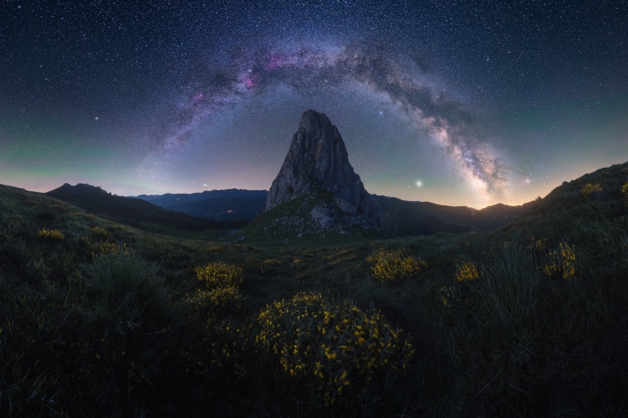 Milky Way Arching Over a Mountain Peak at Night
