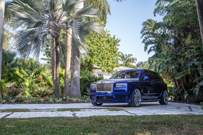 Blue Rolls-Royce Cullinan parked on driveway