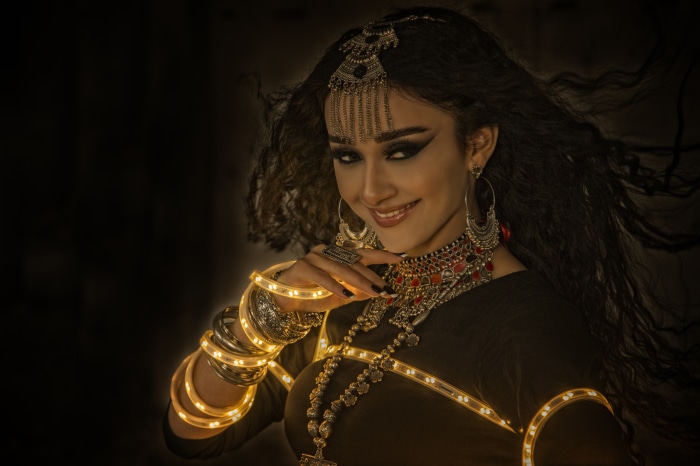 Woman with elaborate jewelry and lights