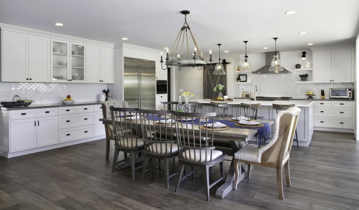Modern kitchen and dining area with island and farmhouse table