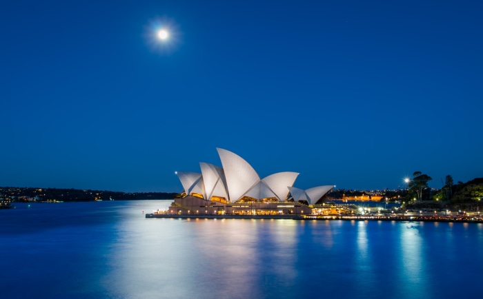 Sydney Opera House at night with moon
