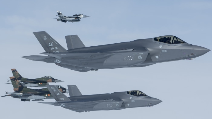 F-35 Lightning II and F-16 Fighting Falcon jets in formation