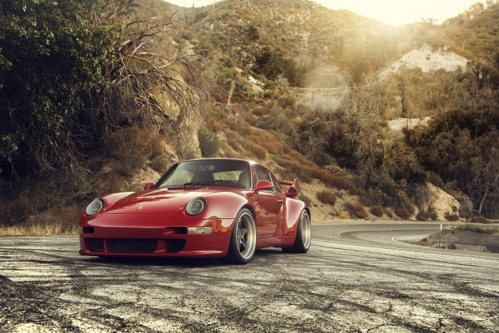Red Porsche 993 Gunther Werks 400R on a mountain road