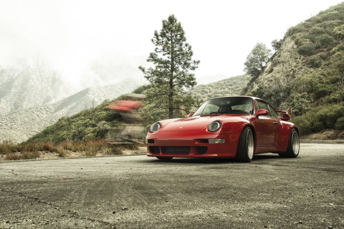 Red Porsche 993 Gunther Werks 400R on mountain road