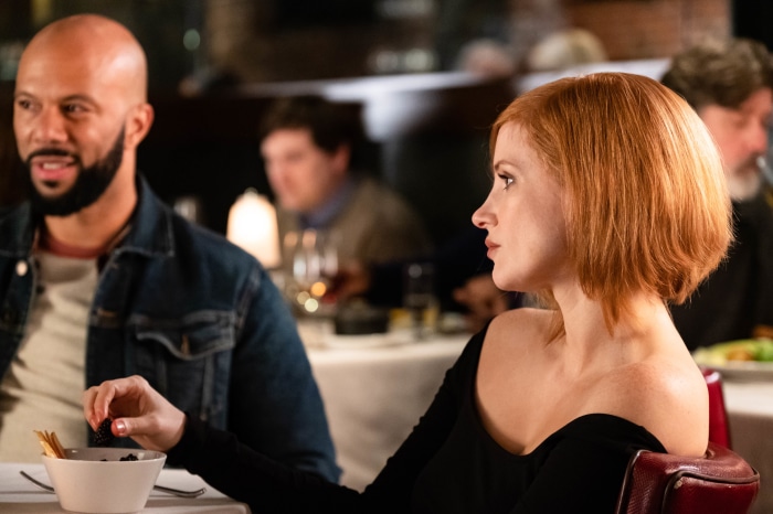 Jessica Chastain and Common at a Dinner Table