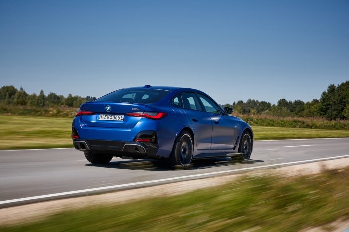 BMW i4 M50 driving on a road
