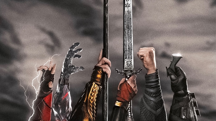 Justice League hands holding weapons and staff