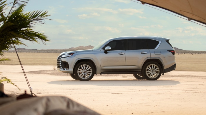 Silver Lexus LX 600 SUV in desert landscape