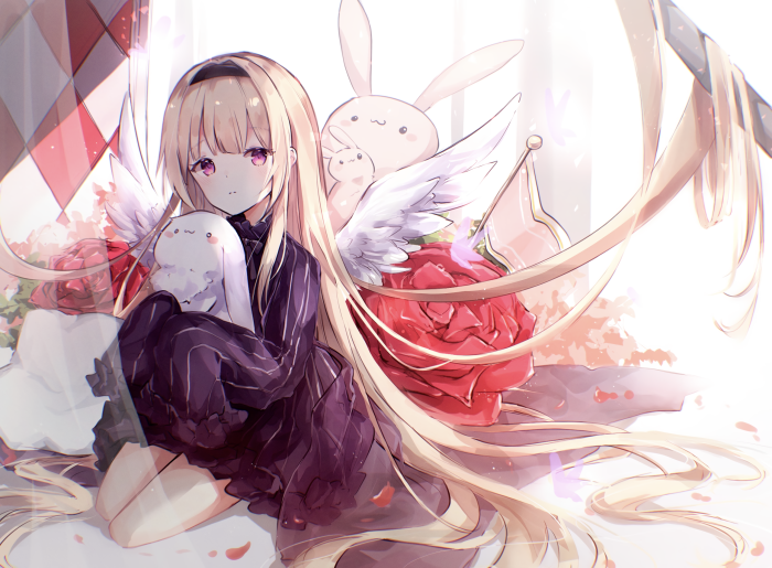 Girl with wings holding a plush toy