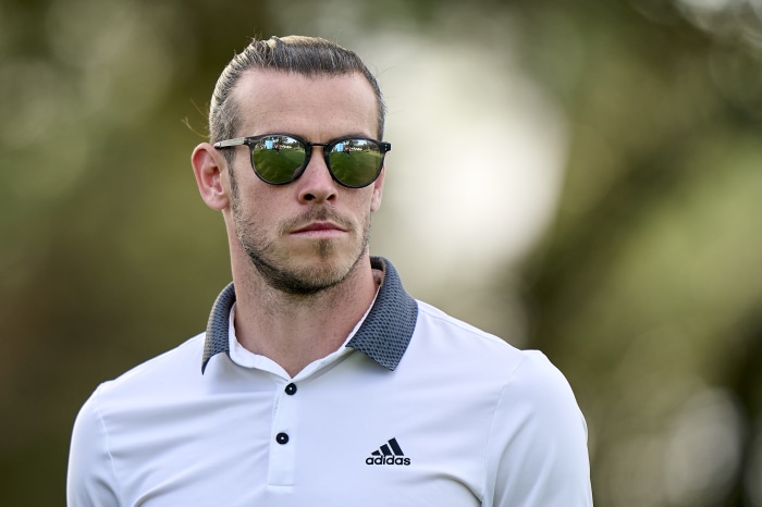 Gareth Bale wearing sunglasses and Adidas golf shirt