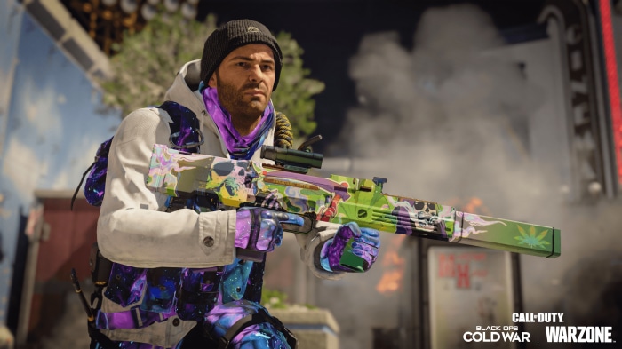 Man holding a custom Call of Duty: Black Ops Cold War weapon